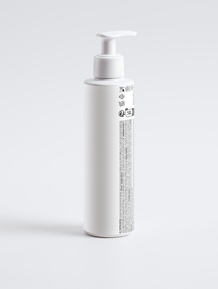 Back of Root + Renew The Clean Slate Purifying Cleanser showing ingredient list, vegan symbol, and recyclable packaging certifications on a white background