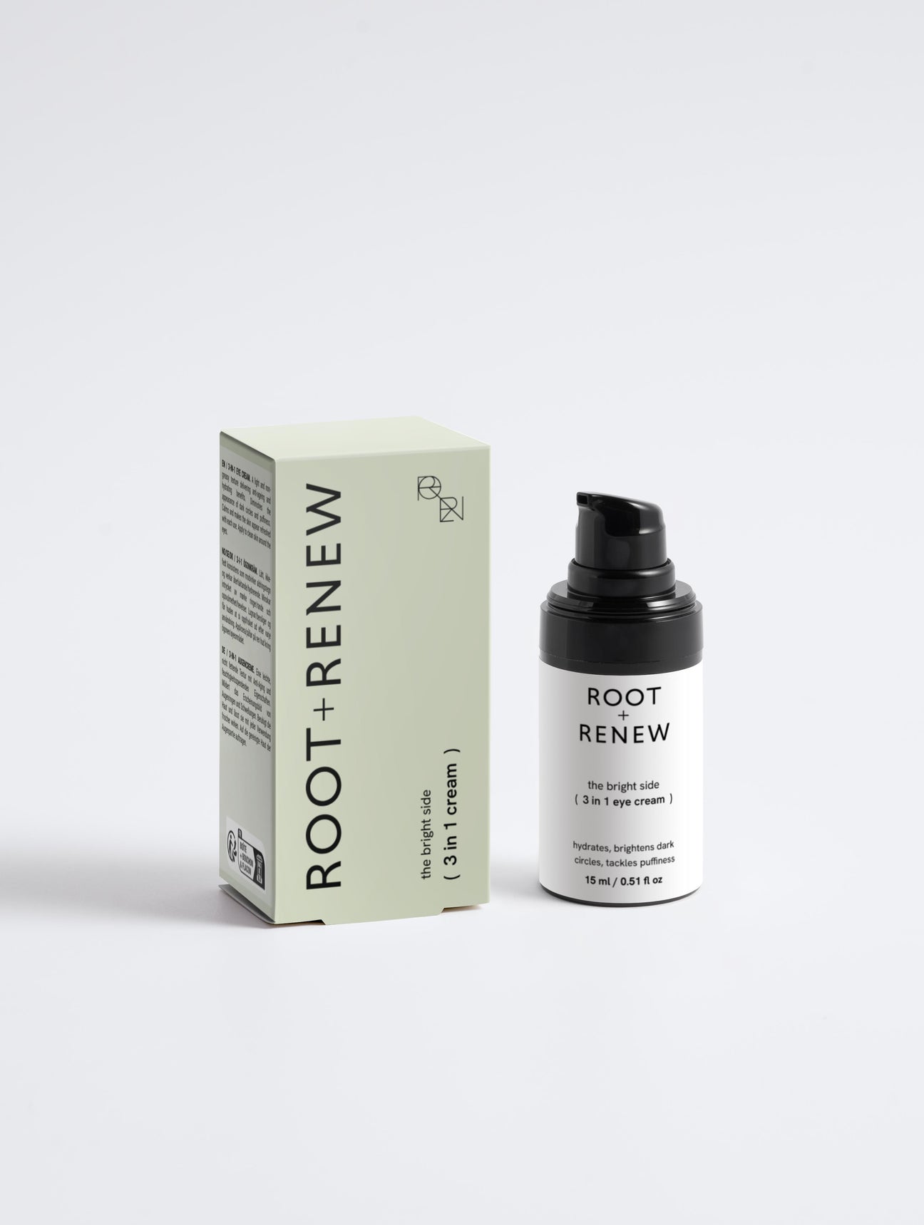 Root + Renew The Bright Side 3-in-1 Eye Cream bottle next to its pastel green box showing product name and sleek minimalist branding