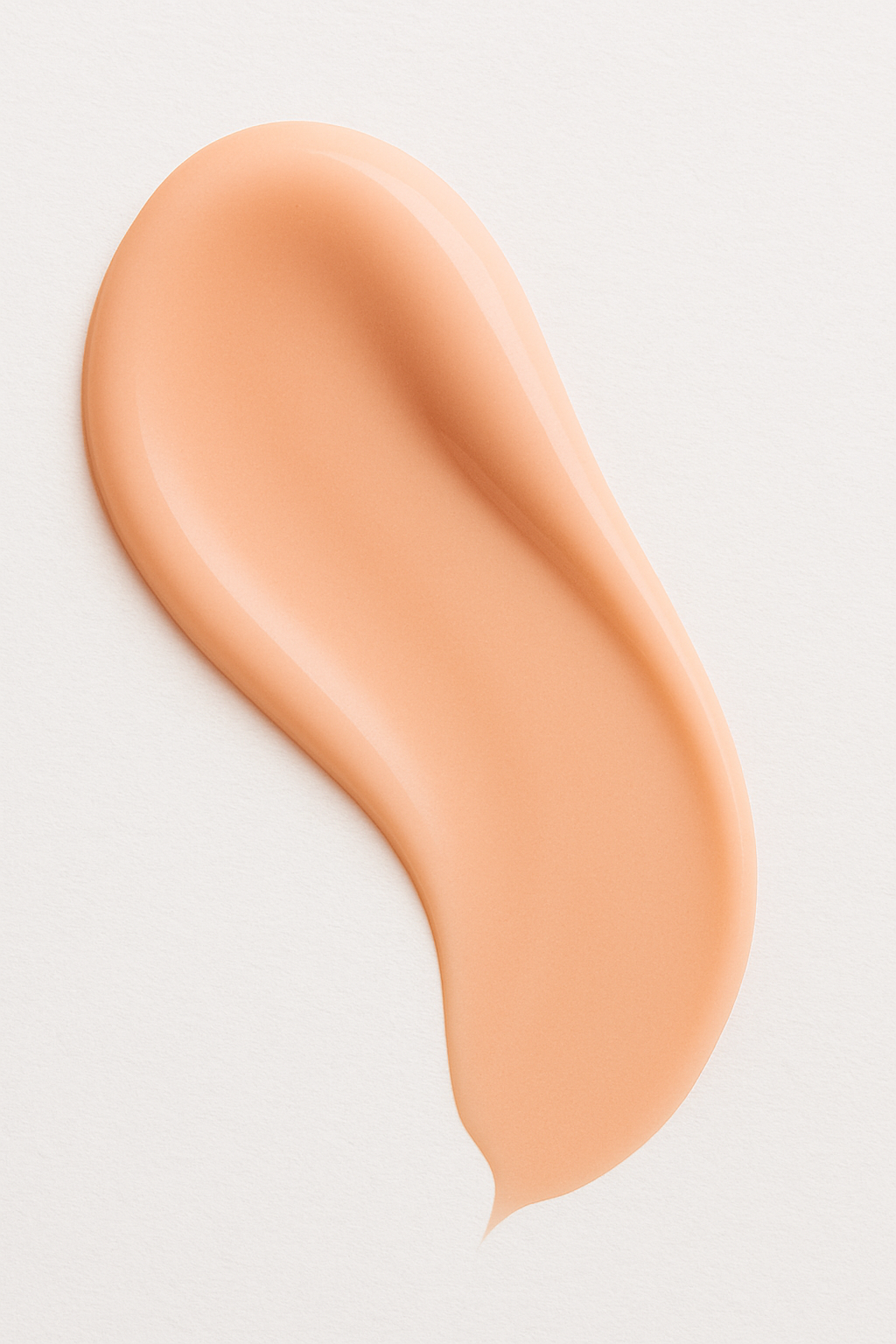 Swatch of Root + Renew The Quench Hydrating Serum in a peach-tinted finish, highlighting smooth lightweight texture designed to deeply hydrate and plump skin.