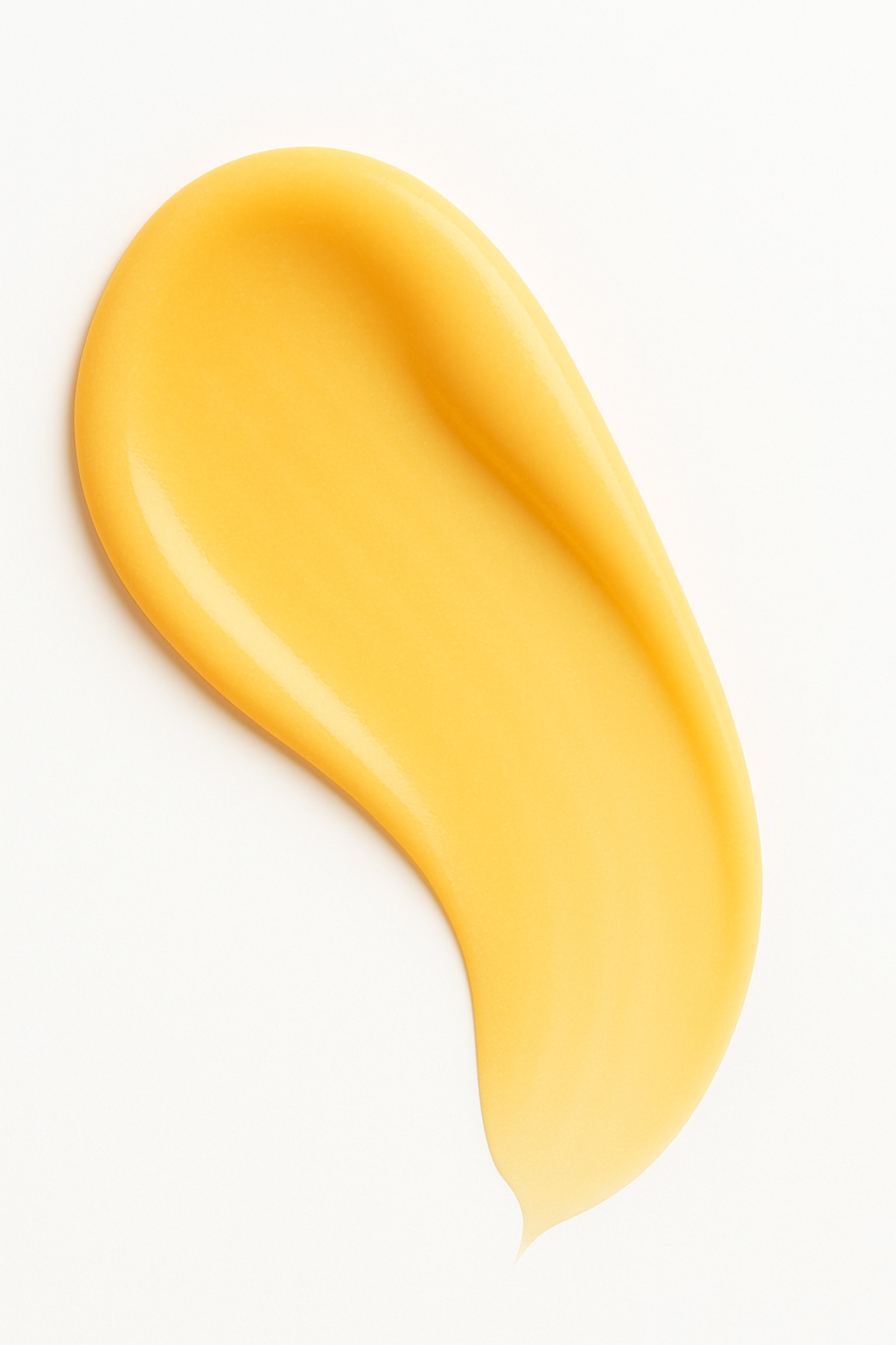 Bright golden-yellow swatch of Root + Renew Vitamin C Serum with silky texture, photographed on neutral background to emphasize antioxidant-rich skincare formula.